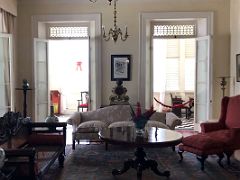 05B The living room has decorative furniture and 19C antiques Devon House mansion Kingston Jamaica